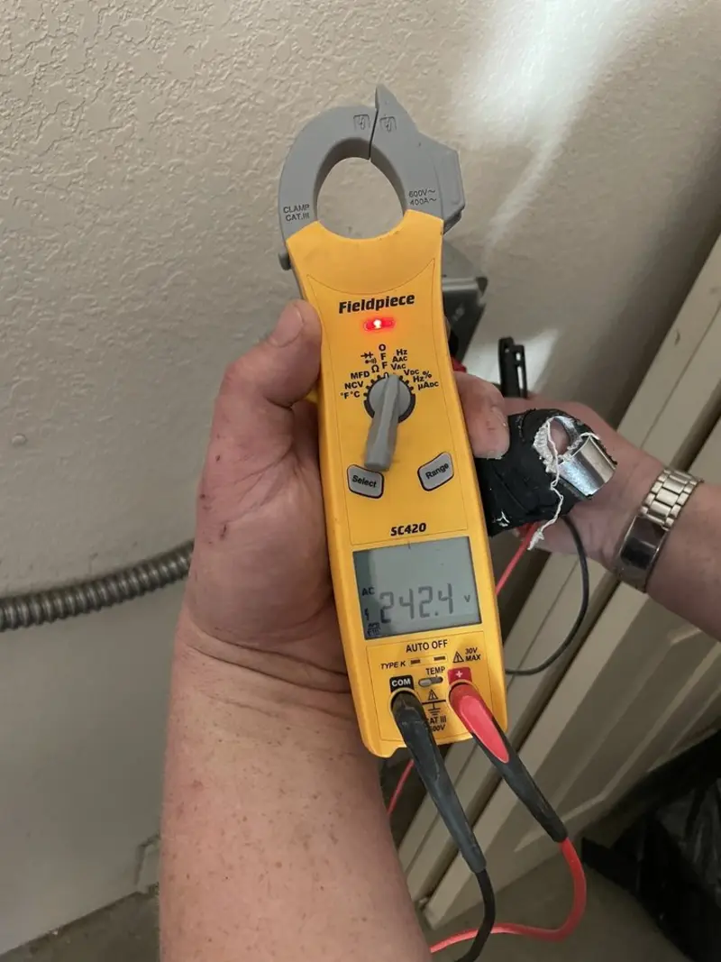 Voltage testing with clamp meter during Hot Tub / Pool Electrical Wiring in Minster